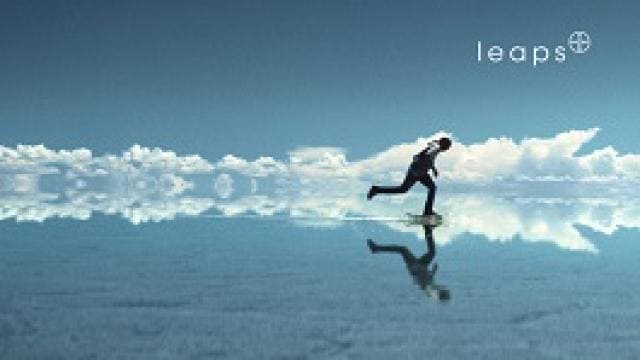 Person running on a reflective surface, resembling a sky above with clouds. The word "leaps" is visible in the top right corner.
