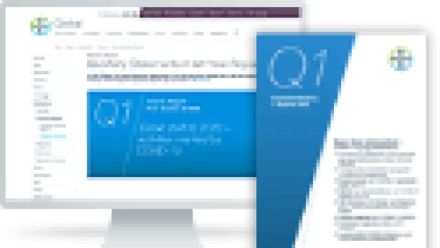 A computer screen displaying a website and a printed document both featuring "Q1" and text related to quarterly performance.