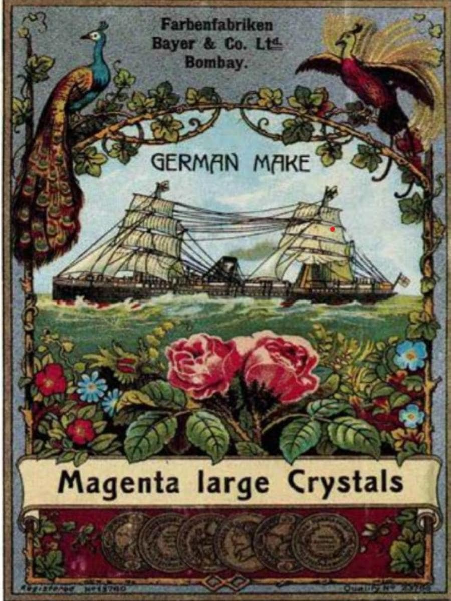Vintage advertisement featuring a sailing ship, peacocks, roses, and the text "German Make Magenta Large Crystals.